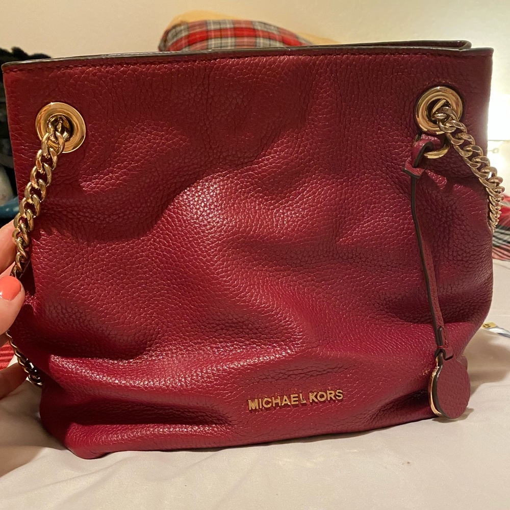 Michael Kors red purse.